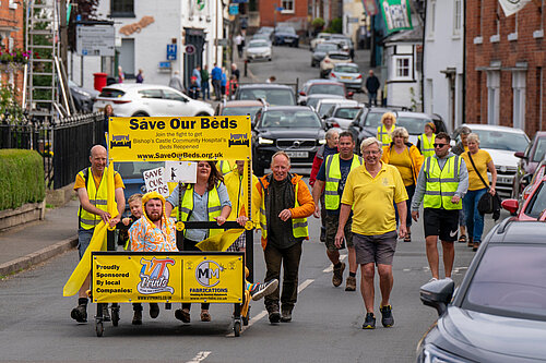 Chris helping to push the bed