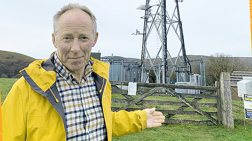 Chris Naylor with a mobile phone mast